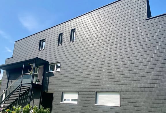 Interlock aluminum panel siding on a modern facade