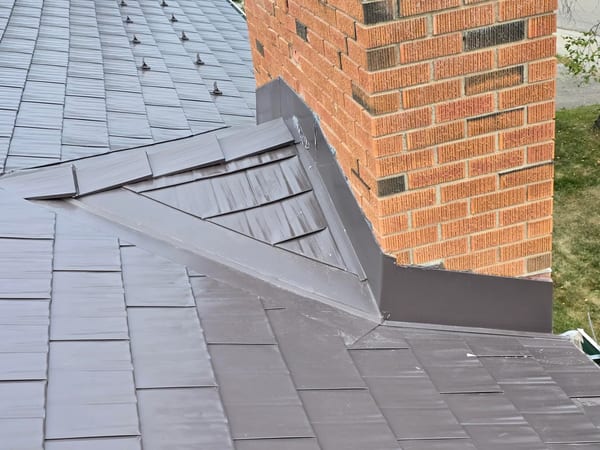 Interlock Aluminum Cedar Shingle Metal Roofing – Tudor Brown | Rocky Mountain House, AB (Chimney flashing detail)