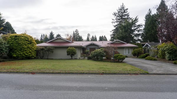 Tile Red Interlock Slate aluminum roof on a ranch style home with a tile red roof in a suburban, Delta, British Columbia