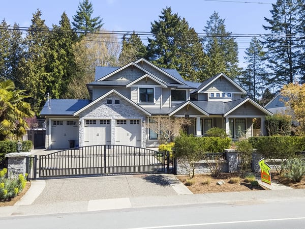 Black Interlock Cedar Shingle aluminum roof on a two-storey modern home with dormers in a forested, Delta, British Columbia