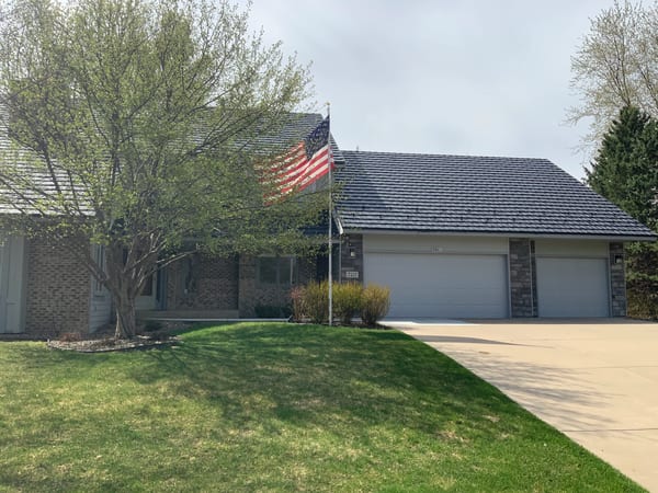 Black Interlock Shake aluminum roof on a ranch home with a metal roof in a suburban setting, Bloomington, Minnesota