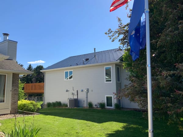Deep Charcoal Interlock Slate aluminum roof on a Deep Charcoal Interlock Slate metal roof on a modern, Rochester, Minnesota