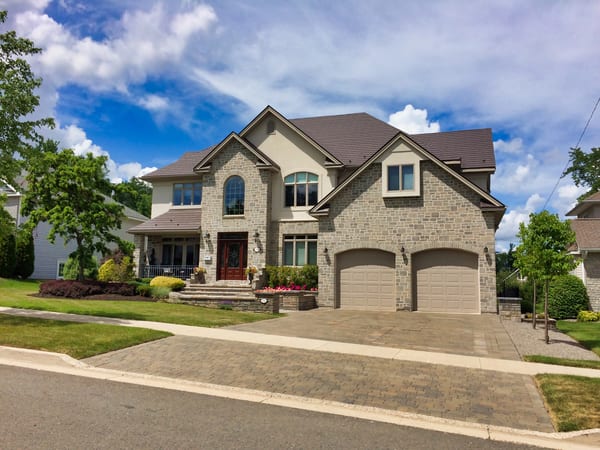 Tudor Brown Interlock Slate aluminum roof on a Tudor-style house with a Tudor Brown metal roof in a, Fredericton, New Brunswick