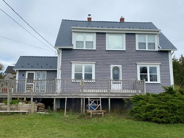 Deep Charcoal Interlock Cedar Shingle aluminum roof on the home, Kingsburg, Nova Scotia