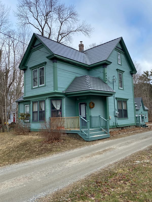 Musket Grey Interlock Cedar Shingle aluminum roof on the home with chimney and dormer, Mahone Bay, Nova Scotia