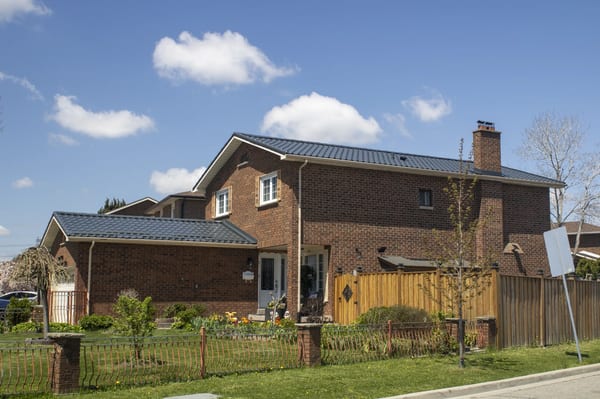 Deep Charcoal Interlock Tile aluminum roof on a two-storey home with a metal roof in Etobicoke, Ontario, Etobicoke, Ontario