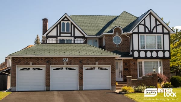 Tudor-style brick home in Nepean, ON with hunter green Interlock aluminum shingle roof, three-car garage, and decorative half-timbering.