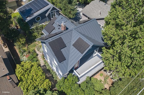 Deep Charcoal Interlock Standing Seam aluminum roof on a modern house with a deep charcoal metal roof in a, Seattle, Washington