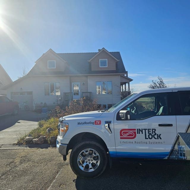Colonial Brown Interlock Cedar Shingle aluminum roof on a colonial home with dormers in a rural setting, Three Hills, Alberta