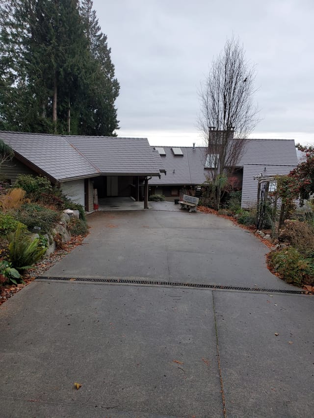 Tudor Brown Interlock Slate aluminum roof on a Tudor style house with brown Interlock Slate metal roof, Roberts Creek, British Columbia