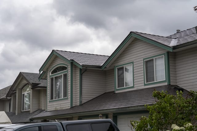 Tudor Brown Interlock Cedar Shingle aluminum roof on a Tudor home with a metal roof in Tudor Brown colour in an, Maple Ridge, British Columbia