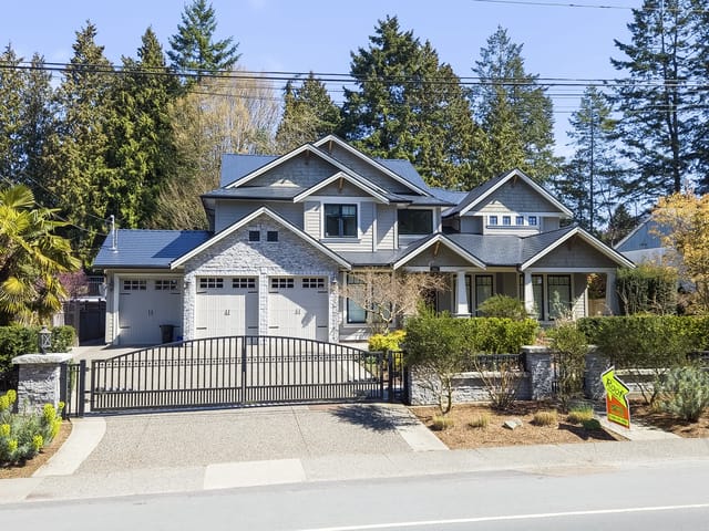 Black Interlock Cedar Shingle aluminum roof on a two-storey modern home with dormers in a forested, Delta, British Columbia