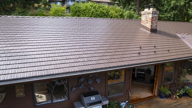 Colonial Brown Interlock Cedar Shingle aluminum roof on a brown one-storey home with a colonial style and a metal, Salt Spring Island, British Columbia