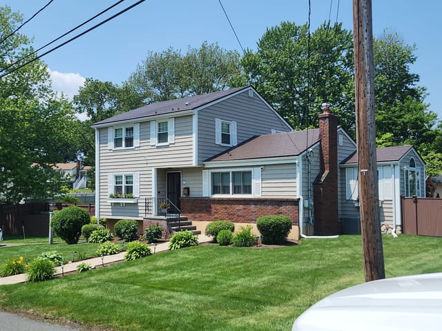 Colonial Brown Interlock metal roof in Saugus, MA