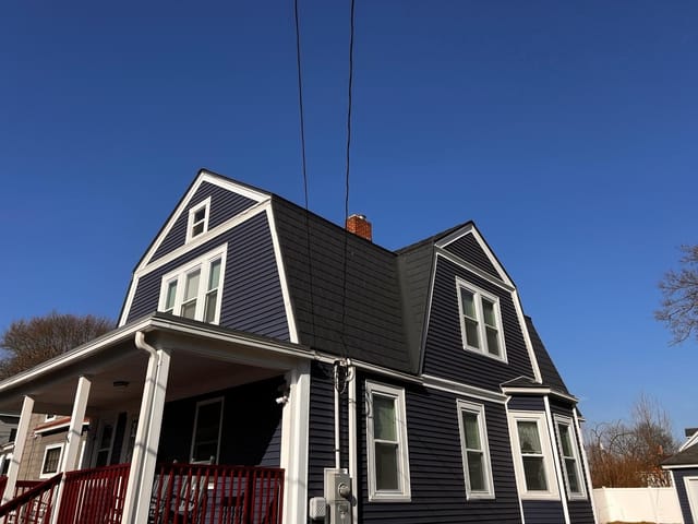 Deep Charcoal Interlock metal roof in Lowell, MA