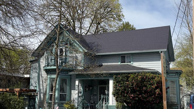 Black Interlock metal roof in Eugene, OR