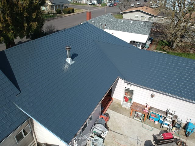 Deep Charcoal Interlock metal roof in Junction City, OR