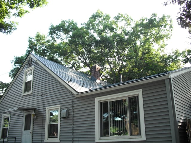 Hunter Green Interlock metal roof in Warwick, RI
