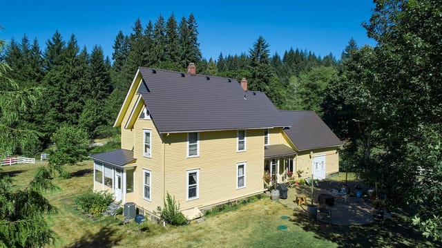 Tudor Brown Interlock metal roof in Longview, WA