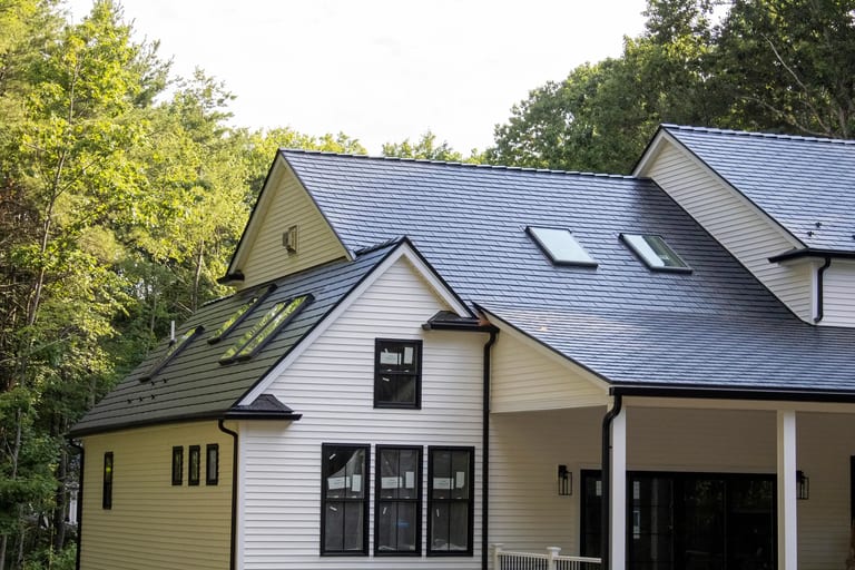 Interior room brightened by a skylight installed in an Interlock metal roof