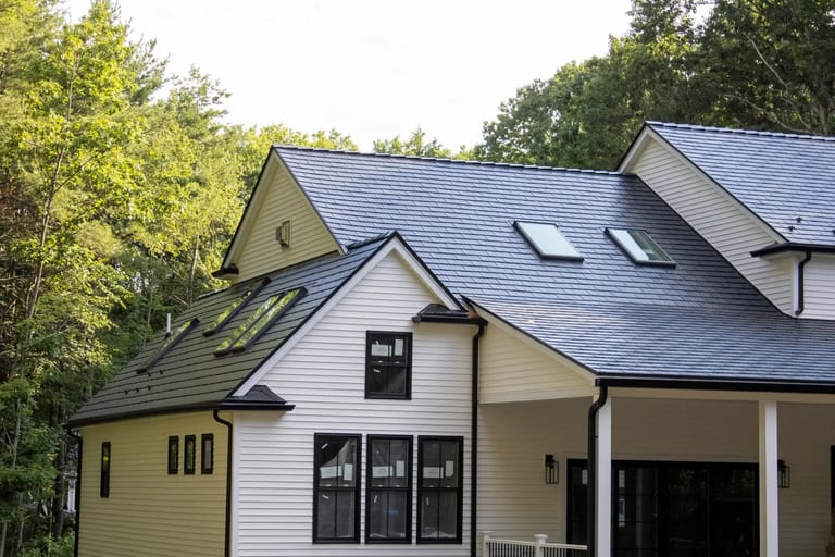 Interior room brightened by a skylight installed in an Interlock metal roof