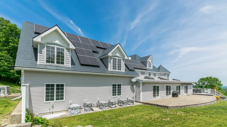 Solar panels mounted on an Interlock metal roof using custom solar mounts