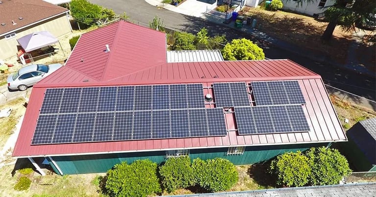 An Interlock metal roof with solar panels, illustrating a solar-friendly roofing system