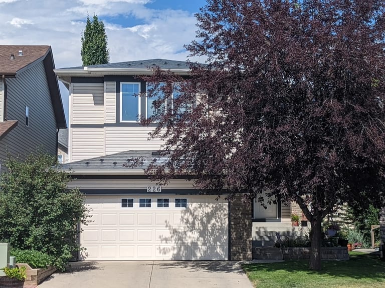 Deep Charcoal Interlock Slate aluminum roof on a two-storey home with a metal roof in Deep Charcoal among, Calgary, Alberta