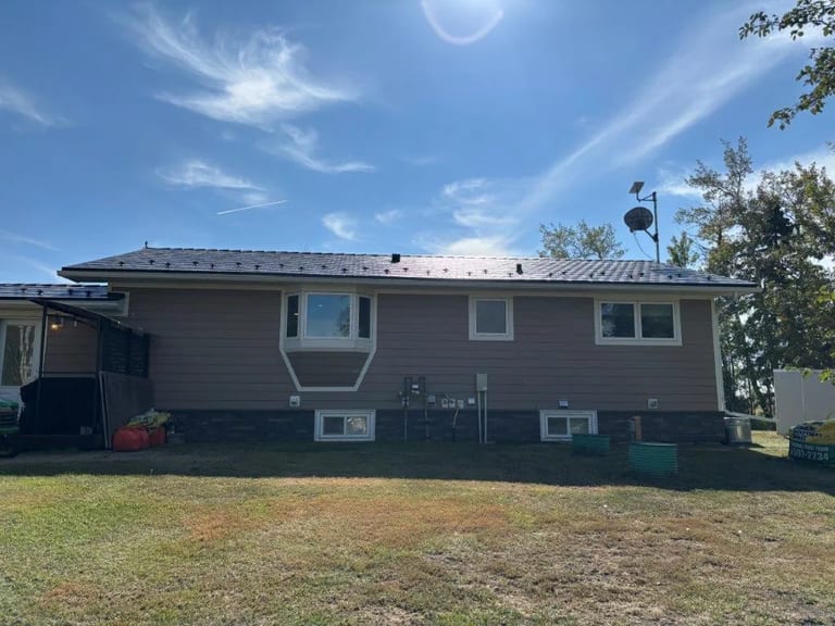 Interlock Aluminum Slate Metal Roofing – Deep Charcoal | Sexsmith, AB (Rear elevation)