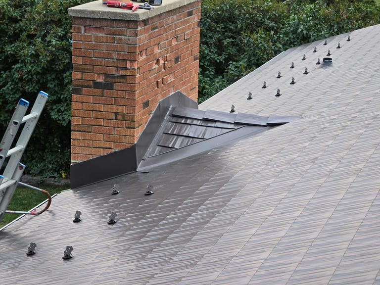 Interlock Aluminum Cedar Shingle Metal Roofing – Tudor Brown | Rocky Mountain House, AB (Chimney flashing detail)