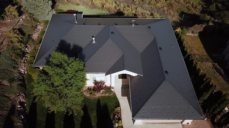 Deep Charcoal Interlock Slate aluminum roof on a large, single-storey home with an Interlock Slate metal, West Kelowna, British Columbia