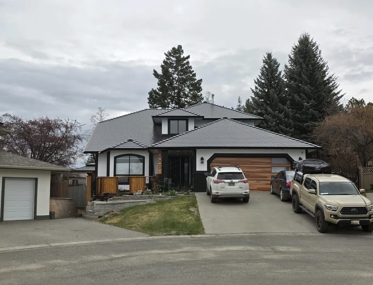 Black Interlock Slate aluminum roof on a black and white modern home with a metal roof on a rural, Kamloops, British Columbia