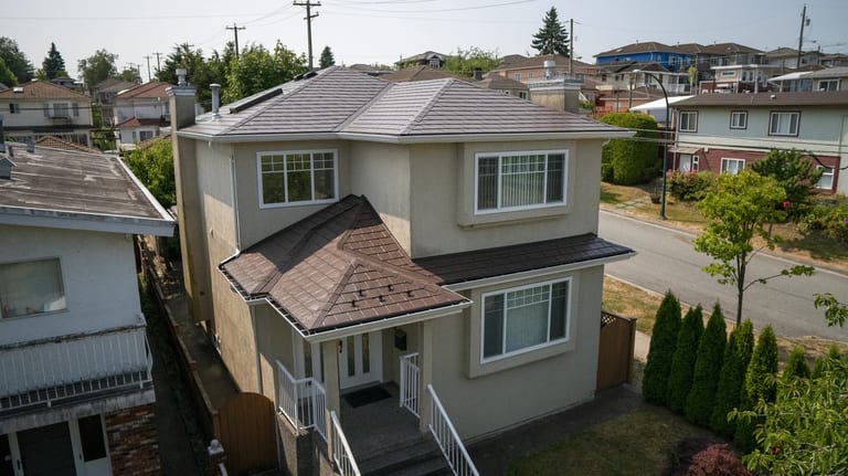 Colonial Brown Interlock Slate aluminum roof on a colonial style home in an urban suburb, Vancouver, British Columbia