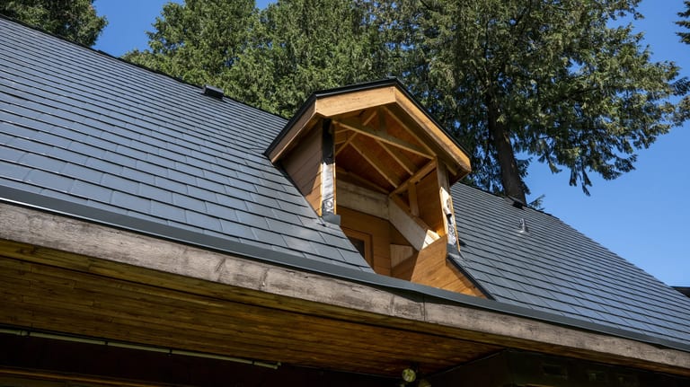 Deep Charcoal Interlock Slate aluminum roof on a house with a metal roof in Burnaby, BC, with a tree in, Burnaby, British Columbia