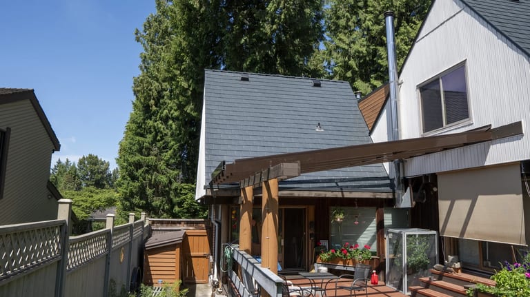 Deep Charcoal Interlock Slate aluminum roof on a single-family modern home in a suburban neighbourhood, Burnaby, British Columbia