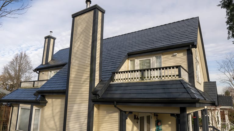 Deep Charcoal Interlock Slate aluminum roof on a beige single-storey craftsman home with a balcony among, Vancouver, British Columbia