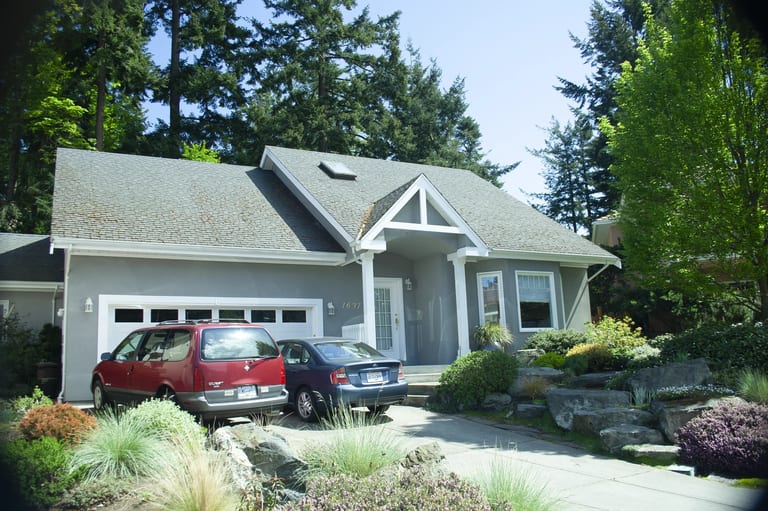 Before: Before: a rotten asphalt shingle roof on the home, Victoria, British Columbia, ahead of a Black Interlock Slate aluminum roof