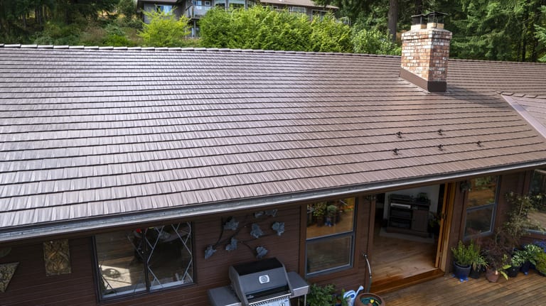 Colonial Brown Interlock Cedar Shingle aluminum roof on a brown one-storey home with a colonial style and a metal, Salt Spring Island, British Columbia