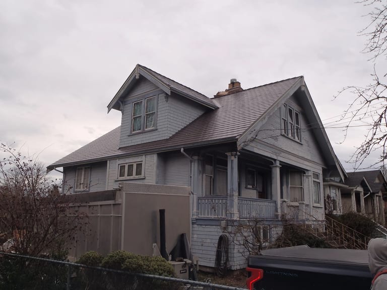 After: Tudor Brown Interlock Cedar Shingle aluminum roof on a Tudor home with a metal roof in an urban setting, Victoria, British Columbia