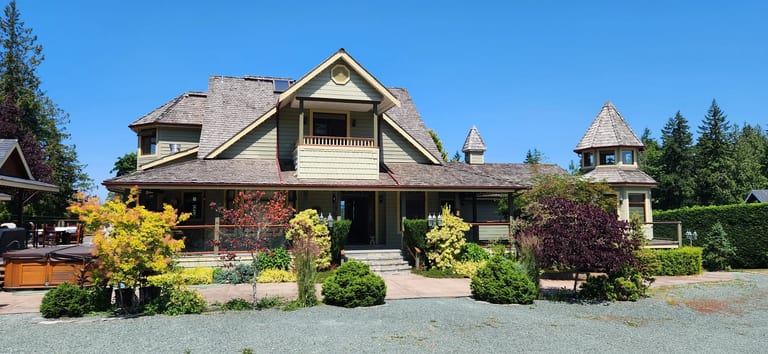 Before: Before: a worn out wood shake roof on the home, Ladysmith, British Columbia, ahead of a Copper Penny Interlock Slate aluminum roof
