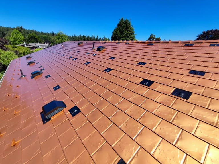 Copper Penny Interlock Slate aluminum roof on a copper penny Interlock Slate metal roof on a two-storey, Victoria, British Columbia