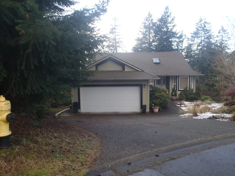 Before: Before: a leaking asphalt shingle roof on the home, Duncan, British Columbia, ahead of a Black Interlock Slate aluminum roof