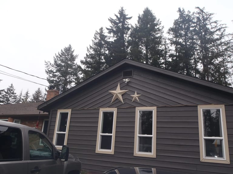 Before: Before: a leaking asphalt shingle roof on the home, Comox, British Columbia, ahead of a Black Interlock Slate aluminum roof