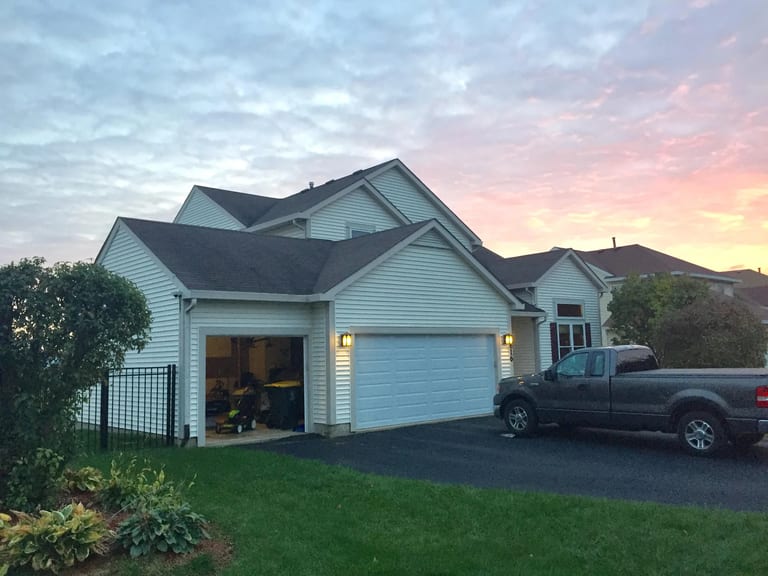 Before: Before: a worn out asphalt shingle roof on the home, Carol Stream, Illinois, ahead of a Colonial Brown Interlock Slate aluminum roof