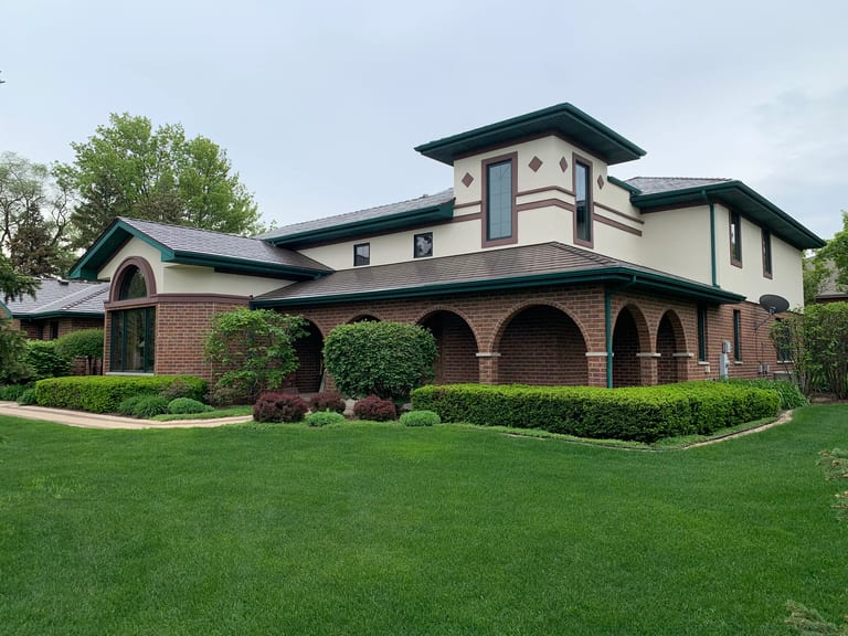 Colonial Brown Interlock Cedar Shingle aluminum roof on a Colonial brown metal roof on a two-storey suburban home, Orland Park, Illinois