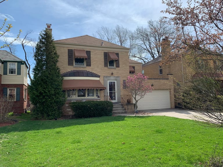Before: Before: a leaking asphalt shingle roof on the home, River Forest, Illinois, ahead of a Colonial Brown Interlock Slate aluminum roof
