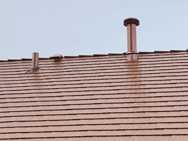 Copper Penny Interlock Cedar Shingle aluminum roof on a copper penny metal roof on a single-family home in a, Bolingbrook, Illinois