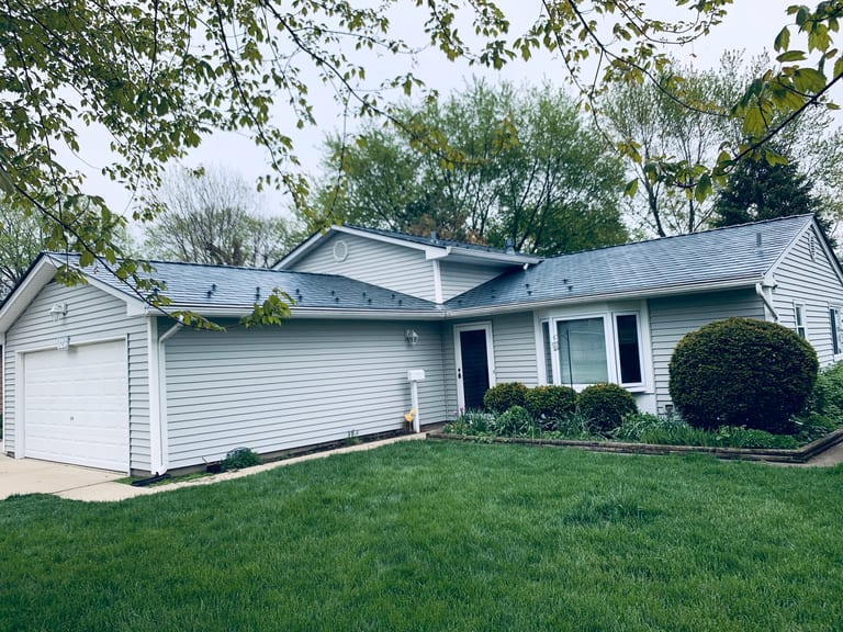 Deep Charcoal Interlock Slate aluminum roof on a house with Deep Charcoal metal roof in a suburban, Elgin, Illinois