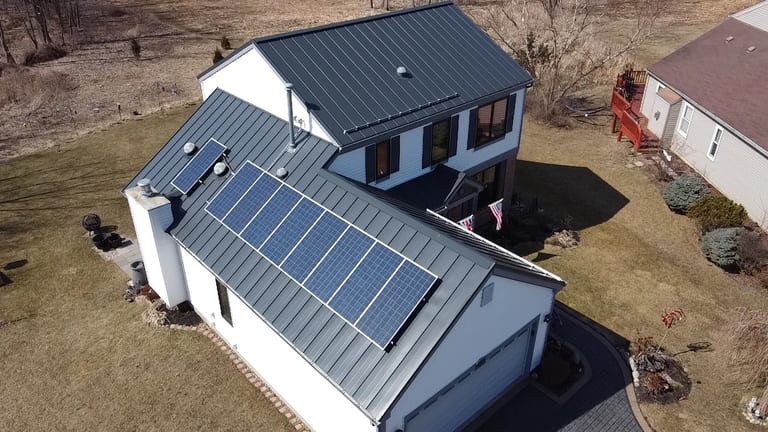 Deep Charcoal Interlock Standing Seam aluminum roof on a modern single-family home with a metal roof in a, Carpentersville, Illinois