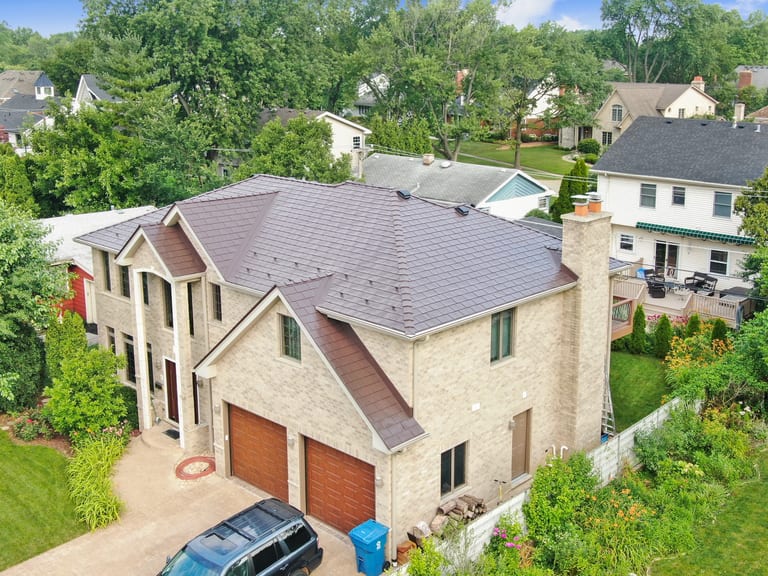Colonial Brown Interlock Slate aluminum roof on a Colonial brown two-storey home with a metal roof in a, Calredon Hills, Illinois